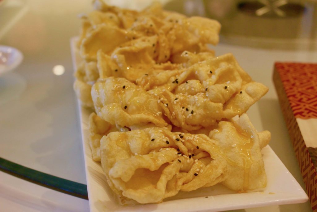 Man Hing's deep-fried egg puffs with honey syrup. Photo by Vicky Wong.