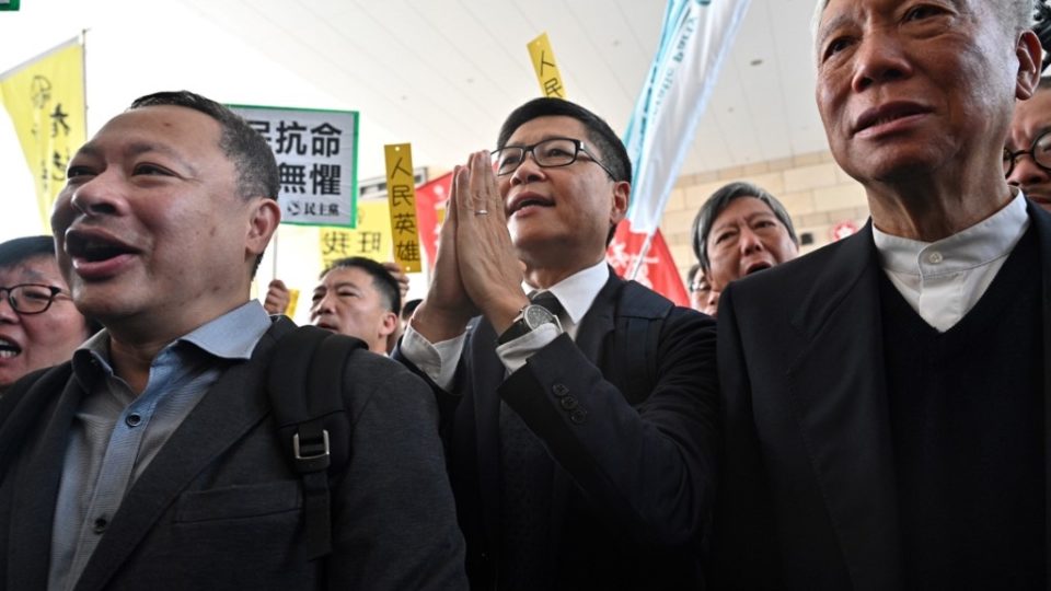 Law professor Benny Tai (left), along with Baptist minister Chu Yiu-ming (right) and sociology professor Chan Kin-man (center) enter the West Kowloon Magistrates Court in April. Tai has said in letters from prison that Hongkongers are beginning to question the viability of nonviolence. Photo via AFP.