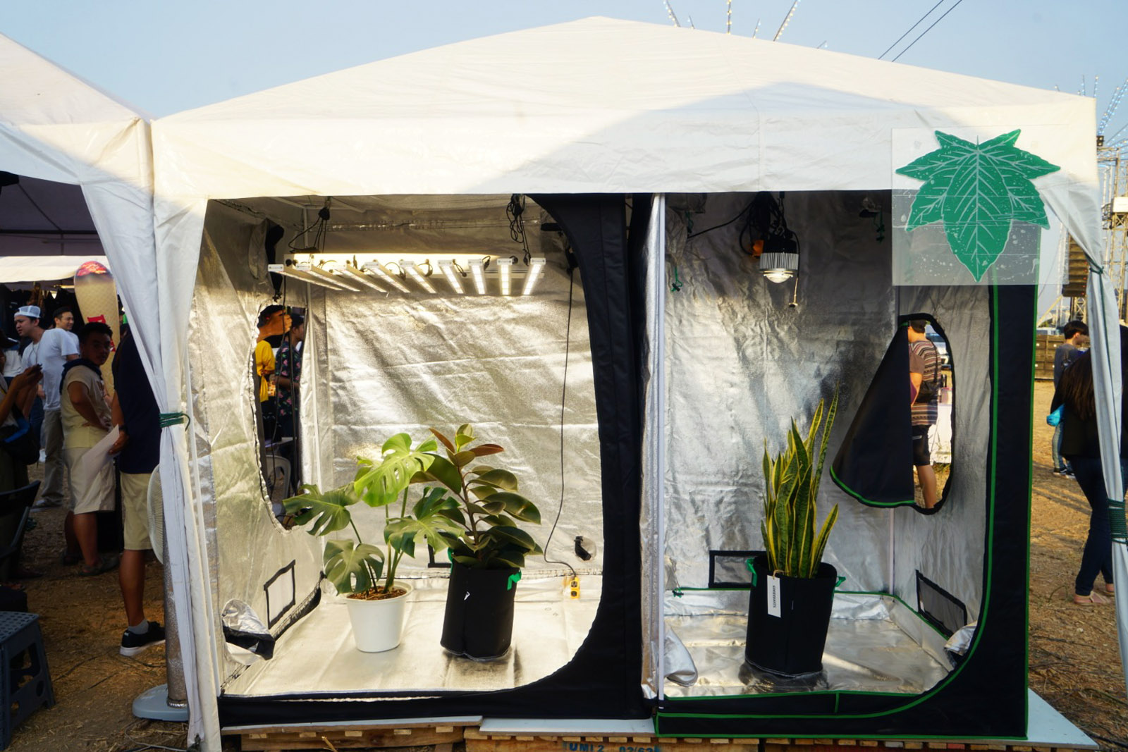 A booth at Highland's 420 festival with grow tents displayed. 