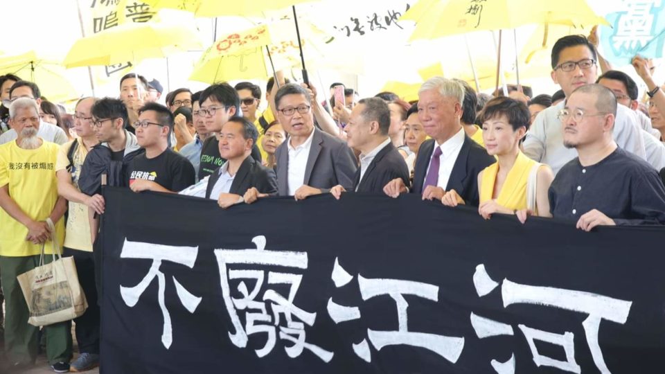 The so-called “Umbrella Nine” outside of court before their sentencing this morning. Photo by Coco Gao.