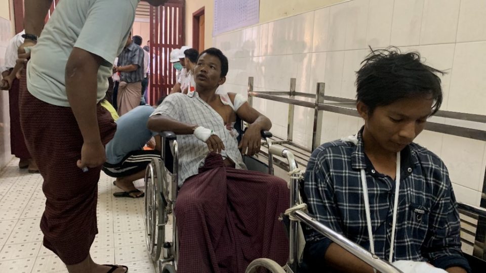 Injured people from Kyauk Tan village in Rathedaung township wait in a hospital in Rakhine state’s capital Sittwe in western Myanmar on May 2, 2019, after the army opened fire on a group of ethnic Rakhine detainees at a school in the village. – Myanmar’s army said it shot dead six detainees in a village school on May 2 while holding 275 men on suspicion of being Rakhine rebels, as fears over military impunity grow in the escalating fighting. (Photo by STR / AFP)