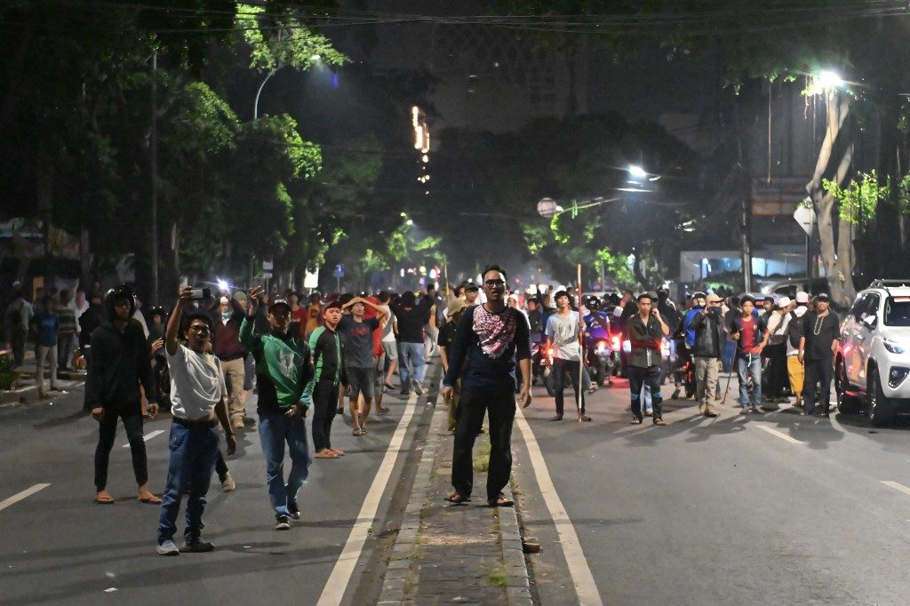 Indonesian protesters take part in a demonstration before being dispersed by the police outside the Elections Oversight Body (Bawaslu) in Jakarta on May 22, 2019. (Photo: Bay Ismoyo / AFP)