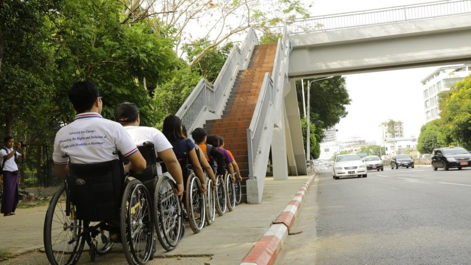Disability rights activists lining up in front of pedestrian walkway in Hledan during ‘accessibility check’ – via Myanmar Independent Living Initiative Facebook page.