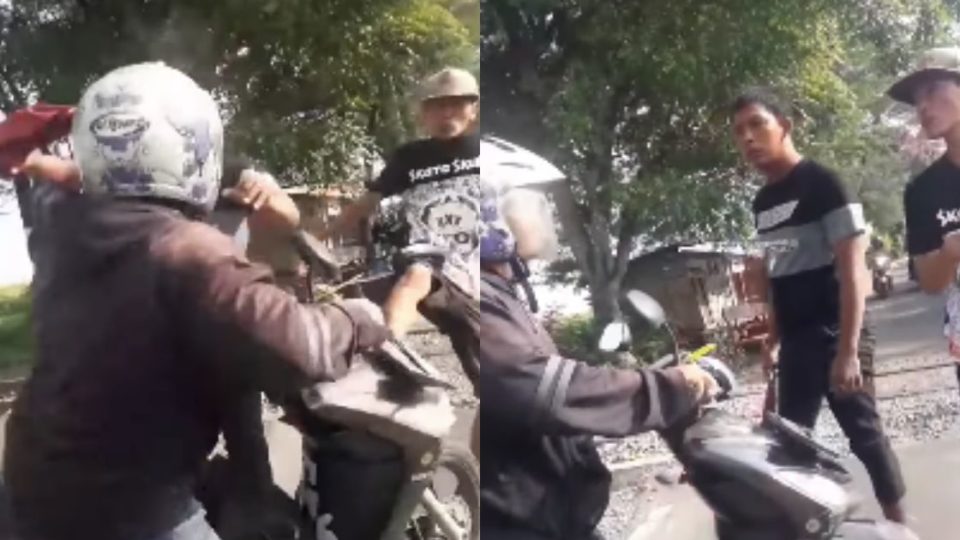 These two unofficial railway guards in  Mojokerto Regency of East Java seem to take their job very, very seriously. Screenshot from Facebook/Sinyo Jr & Youtube/Jemmy Agung