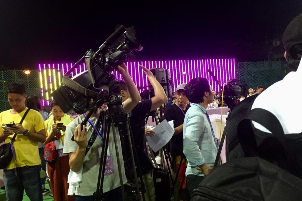 Cameramen crane their necks in preparation for the bun scrambling competition on Cheung Chau on Sunday. Photo by Stuart White.