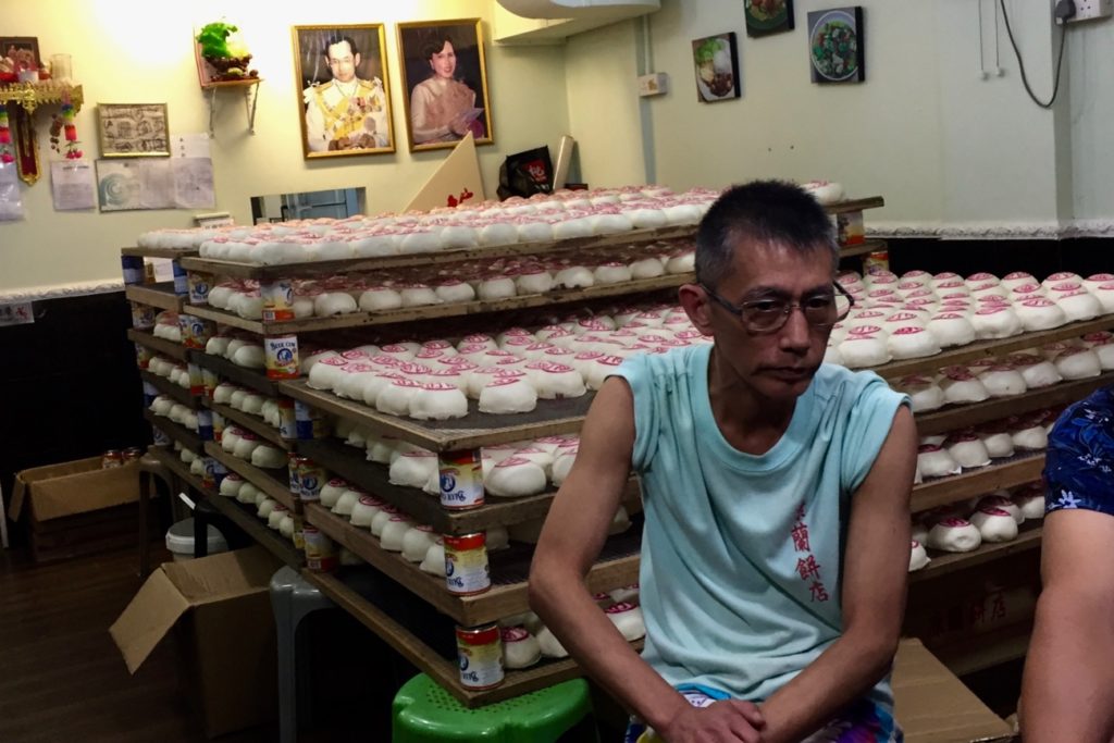 A vendor displays racks filled with hundreds of buns, symbolizing prosperity, at the 2019 Cheung Chau Bun Festival on Sunday. Photo by Stuart White.