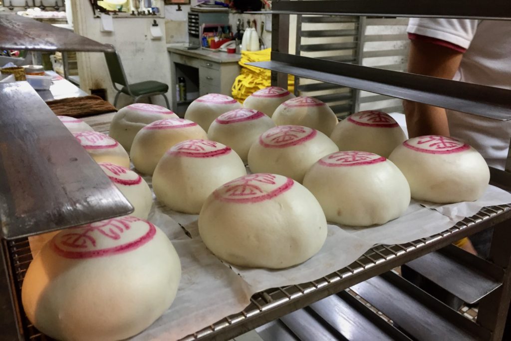 The ubiquitous steamed buns, filled with the likes of lotus, bean paste, and sesame, on Cheung Chau on Sunday. Photo by Stuart White.