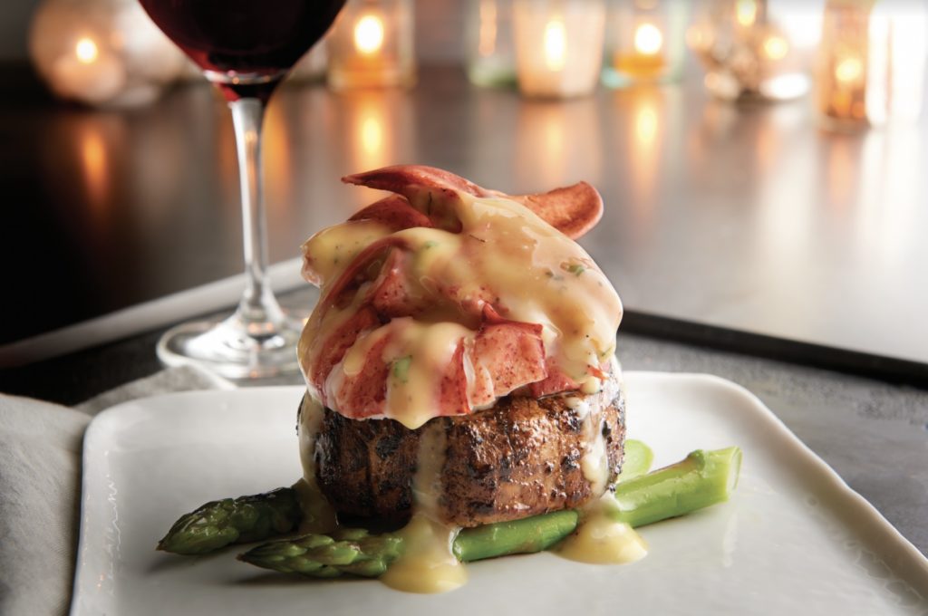 Morton's 6oz center-cut filet mignon Oscar style with asparagus and crab meat. Photo via Katherine Amara.
