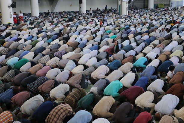 People praying at a mosque. Photo: Matin Firouzabadi/Unsplash