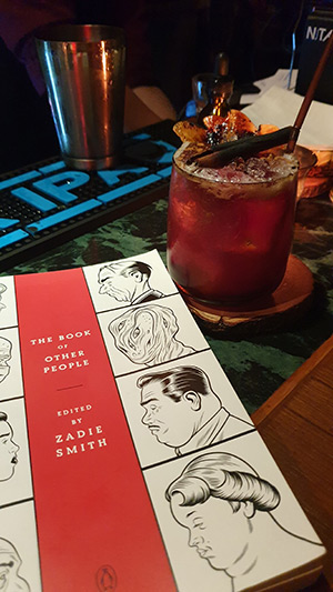 The Mutual promotes literacy by hiding the menu inside texts. Baz's signature drink, the Allen's Apple, at right.