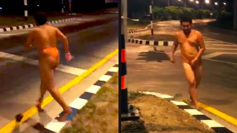 A happy Liverpool fan streaking through a red light, as promised before last night’s game. Screenshot: Panya Sainet/ Facebook 
