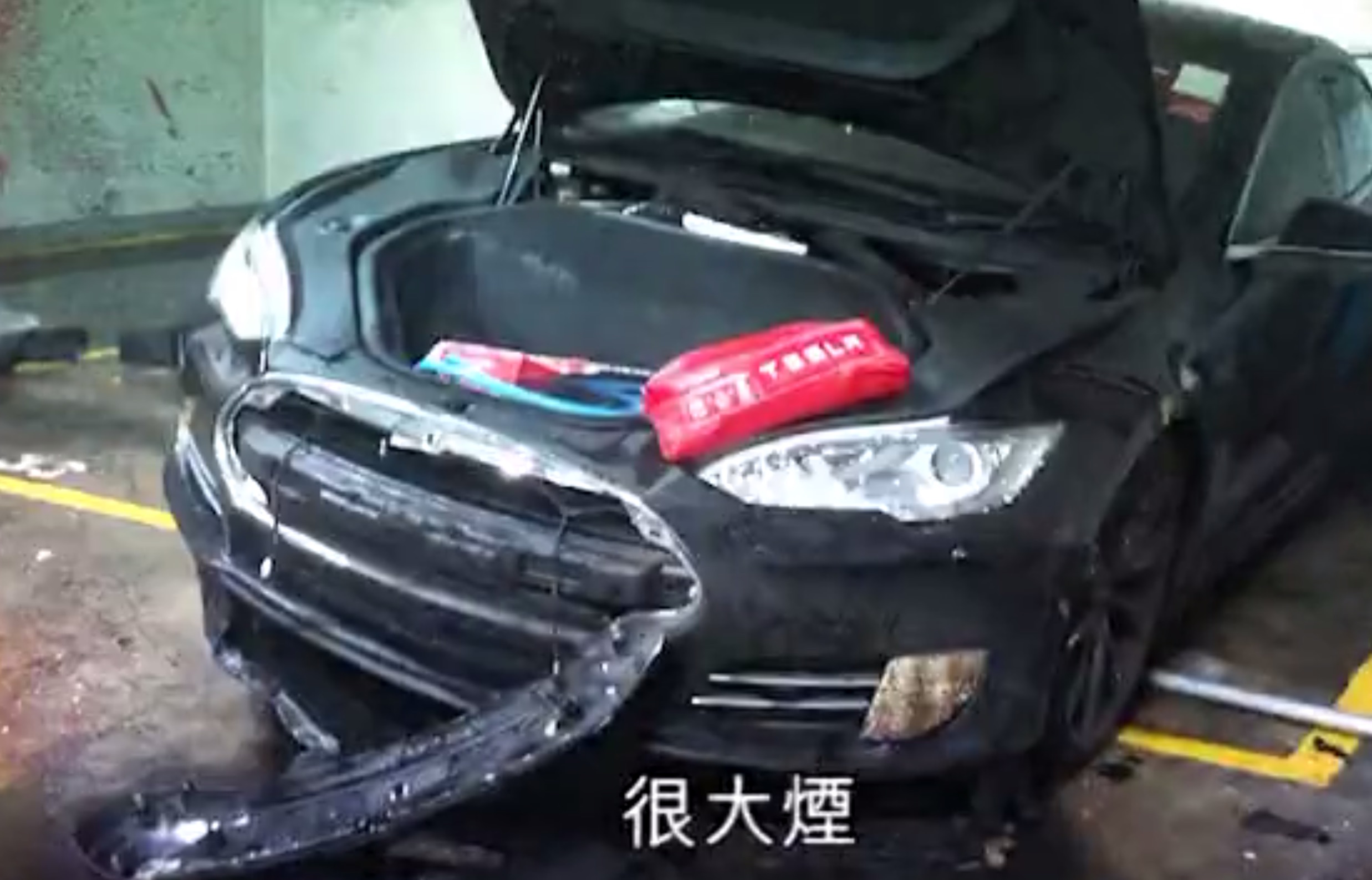 Aggravated battery? Tesla Model S bursts into flames at Hong Kong ...