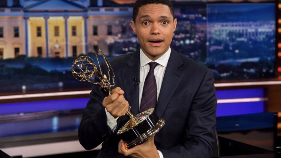 Trevor Noah holding an Emmy award. Photo via Trevor Noah/FB