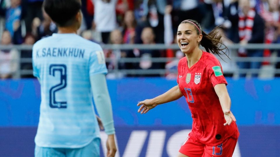 United States’ forward Alex Morgan, at right, celebrates Tuesday after scoring a goal during the France 2019 Women’s World Cup Group F football match between USA and Thailand at the Auguste-Delaune Stadium in Reims, France. Photo: Thomas Samson / AFP