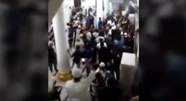 Protesters storming a mosque demanding the removal of a preacher over ideological differences in Aceh, Indonesia. Photo: Youtube screengrab