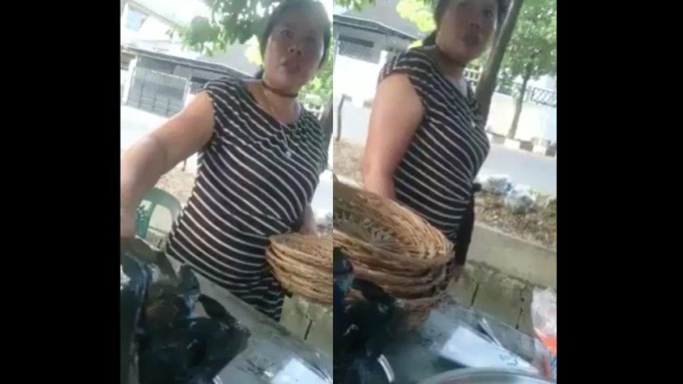 Milla, a rujak cingur (Javanese cow muzzle salad) seller in Surabaya, in the viral video. Screenshot from Facebook/Yang Lagi Viral