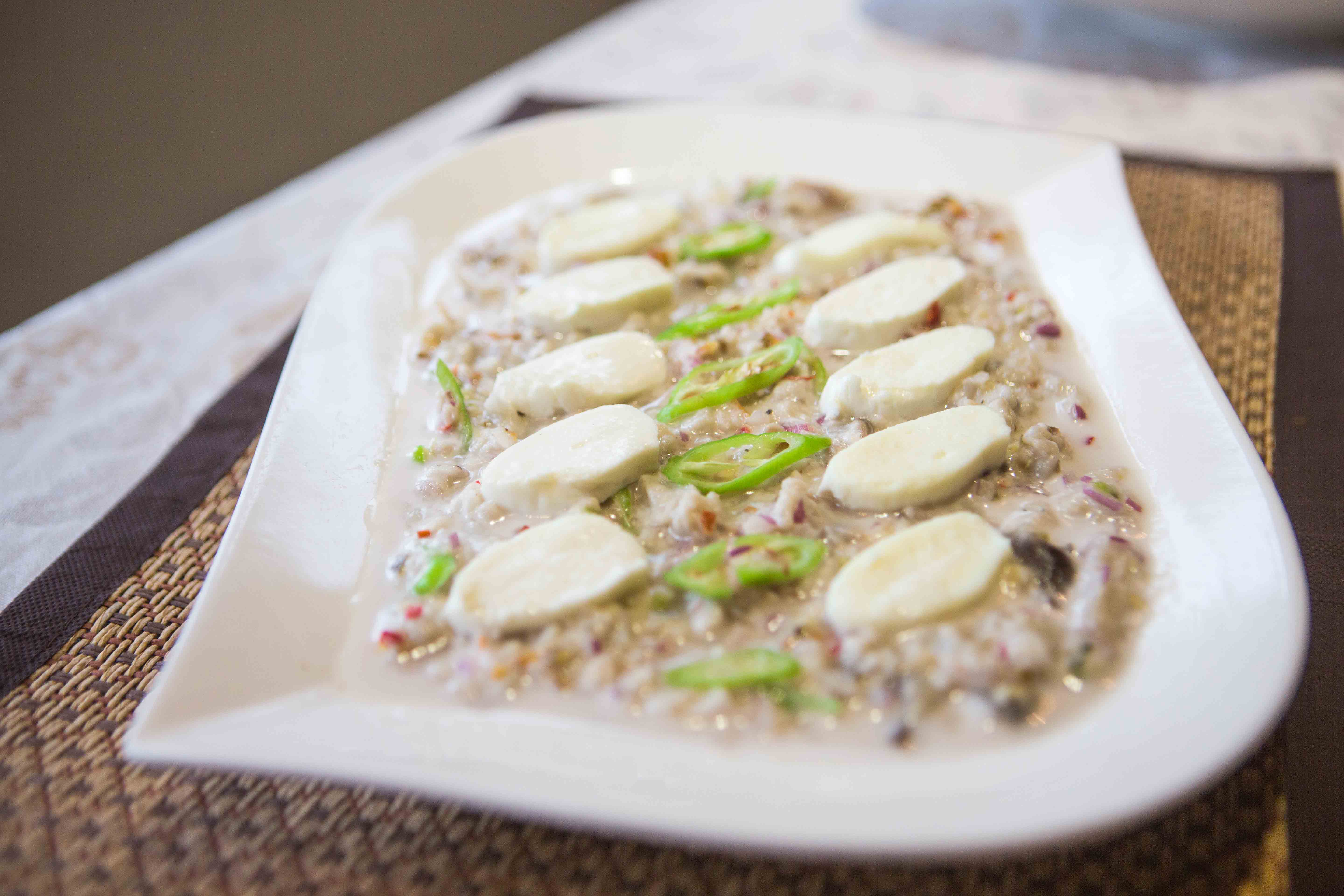 Bangus kinilaw topped with kesong puti. (Photo: Jacques Manuntag/Coconuts)