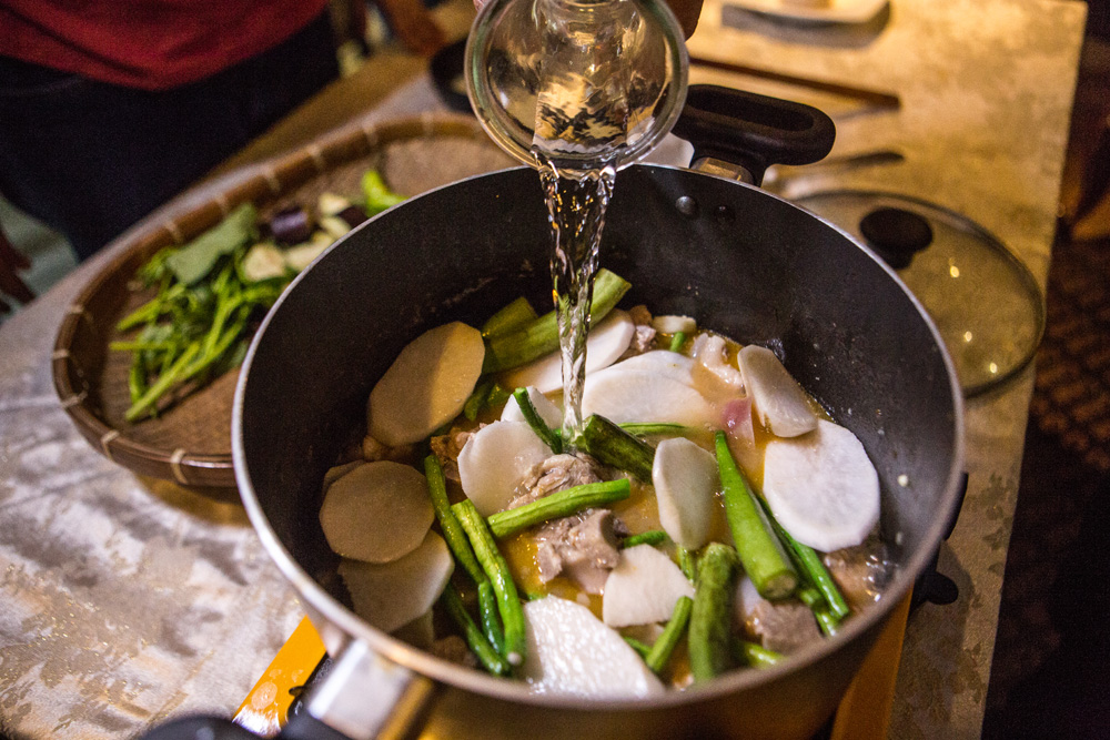 The sour soup sinigang. (Photo: Jacques Manuntag/Coconuts)