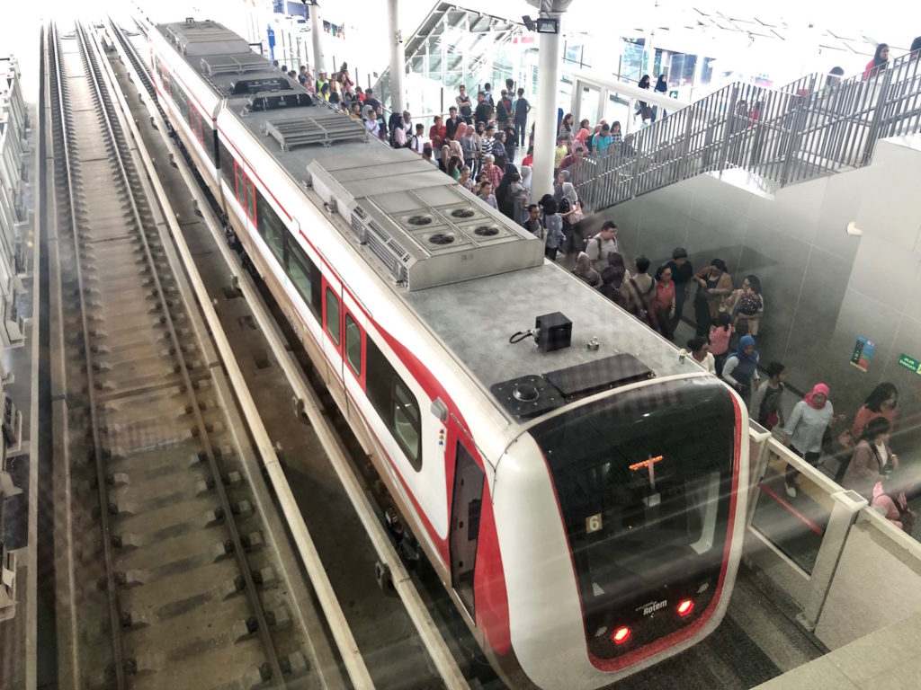 Passengers exiting the train at Boulevard Utara (North Boulevard) Station during the LRT Jakarta free public trial run. Photo: Nadia Vetta Hamid/Coconuts Media