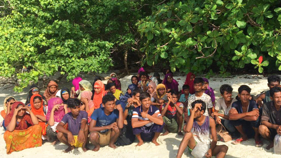 Rohingya sit Tuesday on abandoned island off the coast from Saturn province Photo: National Parks Wildlife and Plant Conservation Department