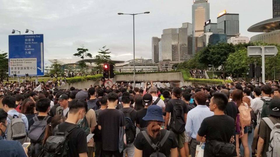 Protesters block a road behind the Central Government Offices complex in Admiralty this evening. Photo by Vicky Wong.