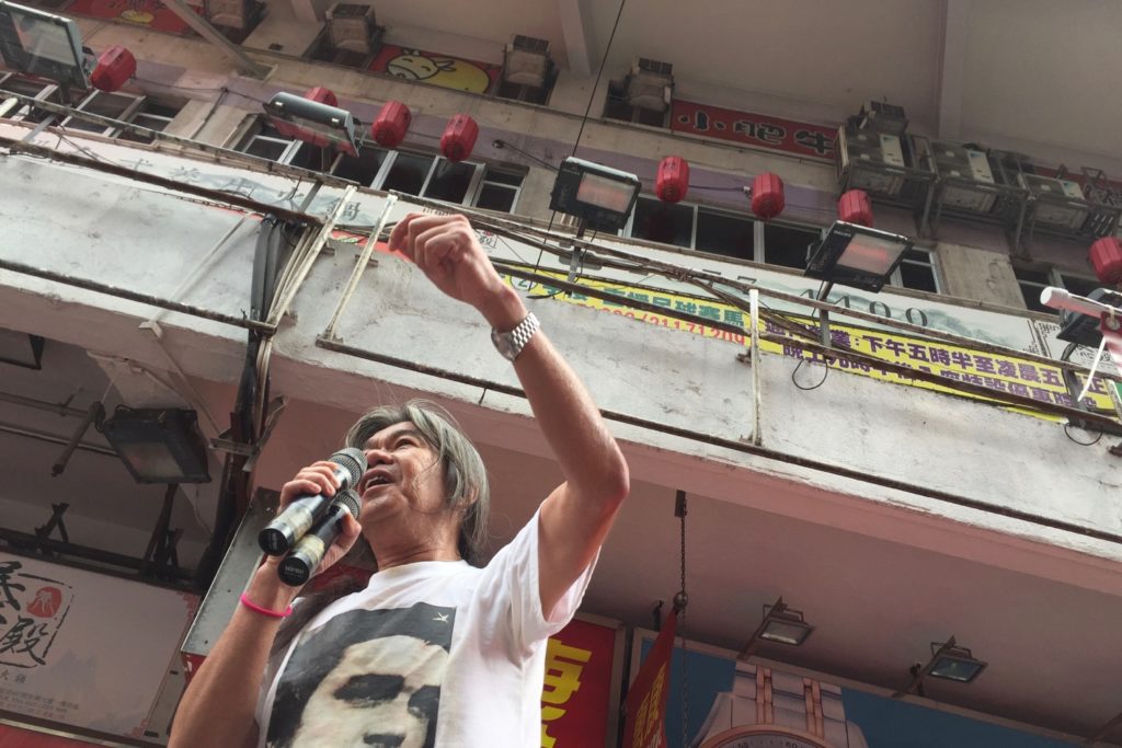 Long-time pro-democracy activist Leung 'Long Hair' Kwong-hung fires up protesters with chants of 'Carrie Lam, step down!' Photo by Stuart White.