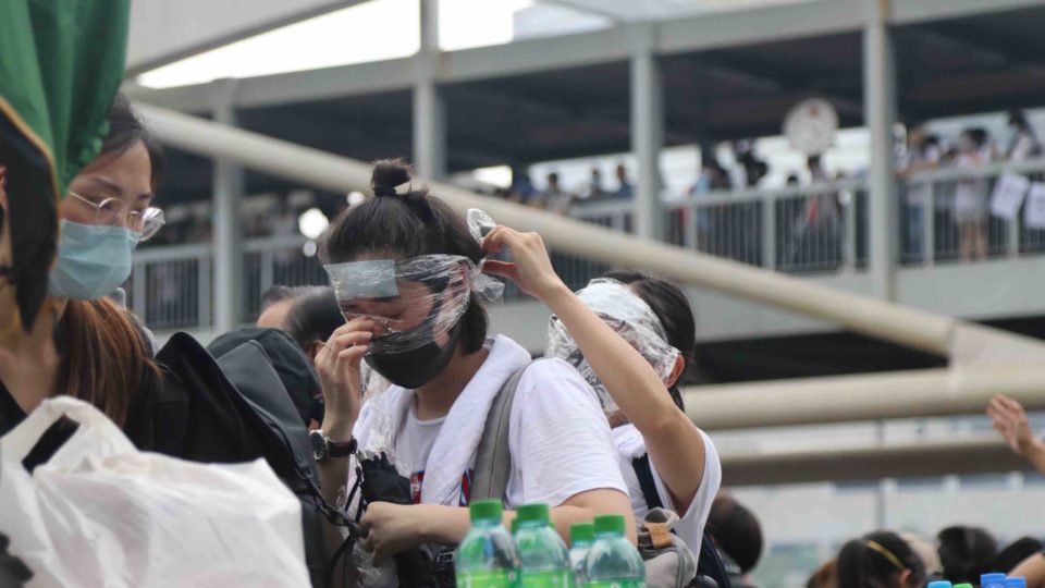 A woman reacts after being tear gassed at an demonstration against a controversial extradition law on June 12. Photo by Samantha Mei Topp.