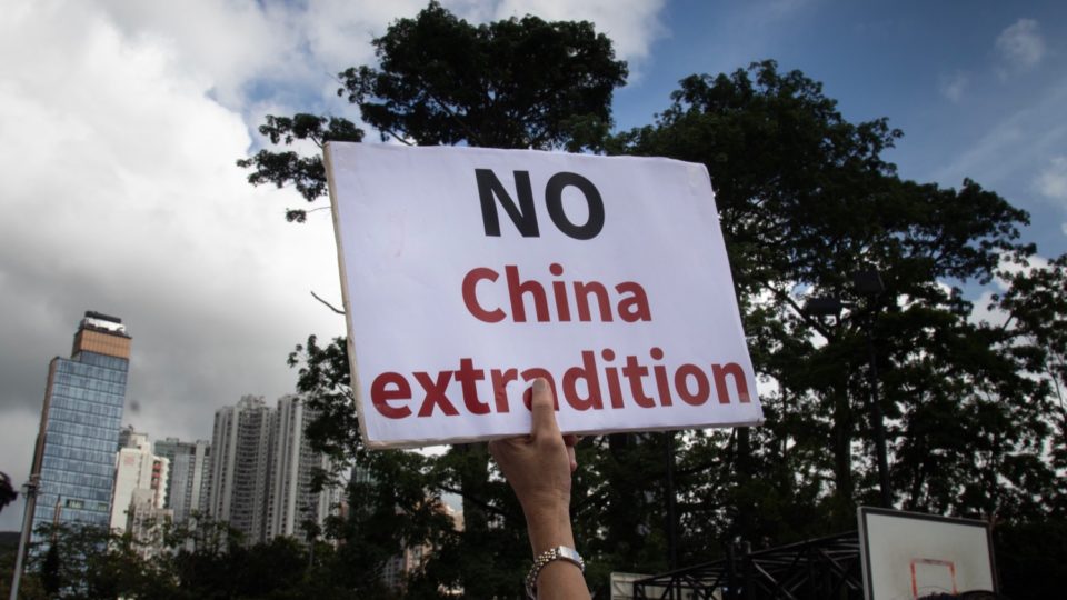 A protester holds up a “no China extradition” sign during a march on June 9, 2019. Photo by Samantha Mei Topp.