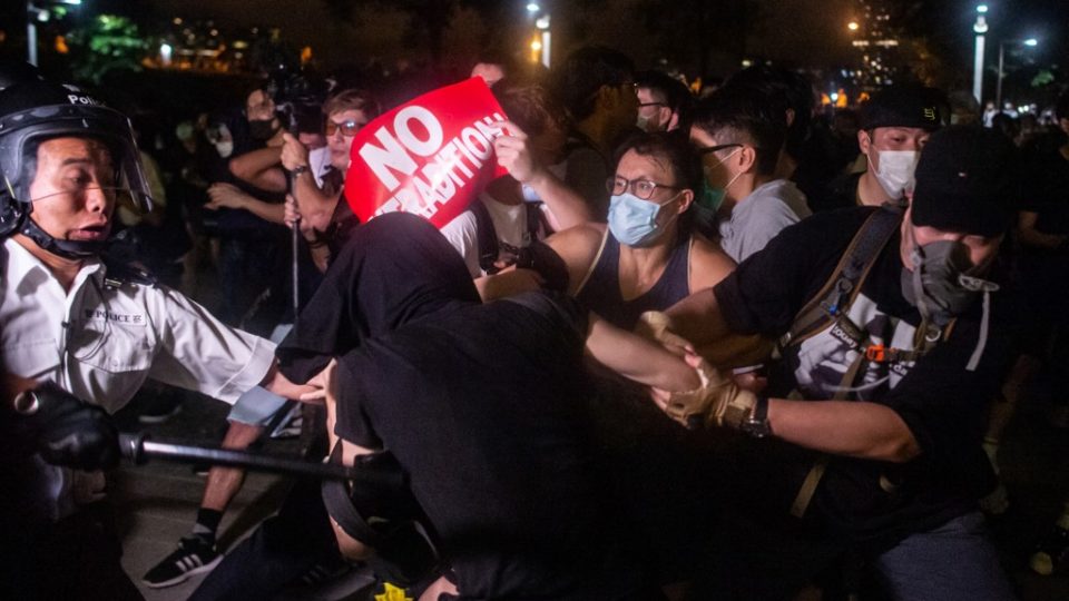 A sign of ‘No Extradition’ is held by protesters during the clashes with the police at Legislative Council in Hong Kong after a rally against a controversial extradition law proposal in Hong Kong on early June 10, 2019. Photo by Philip Fong / AFP