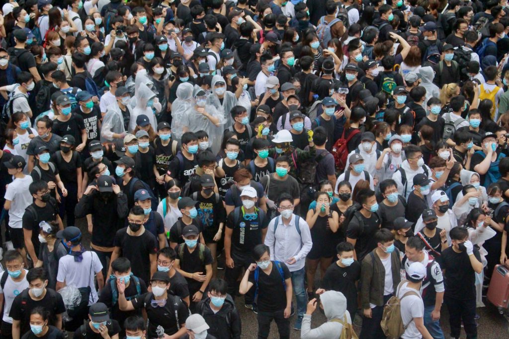 Thousands of protesters flood Connaught Road Central in a bid to stop lawmakers from entering the Legislative Council to hold a second reading of a controversial extradition bill. Photo by Vicky Wong.