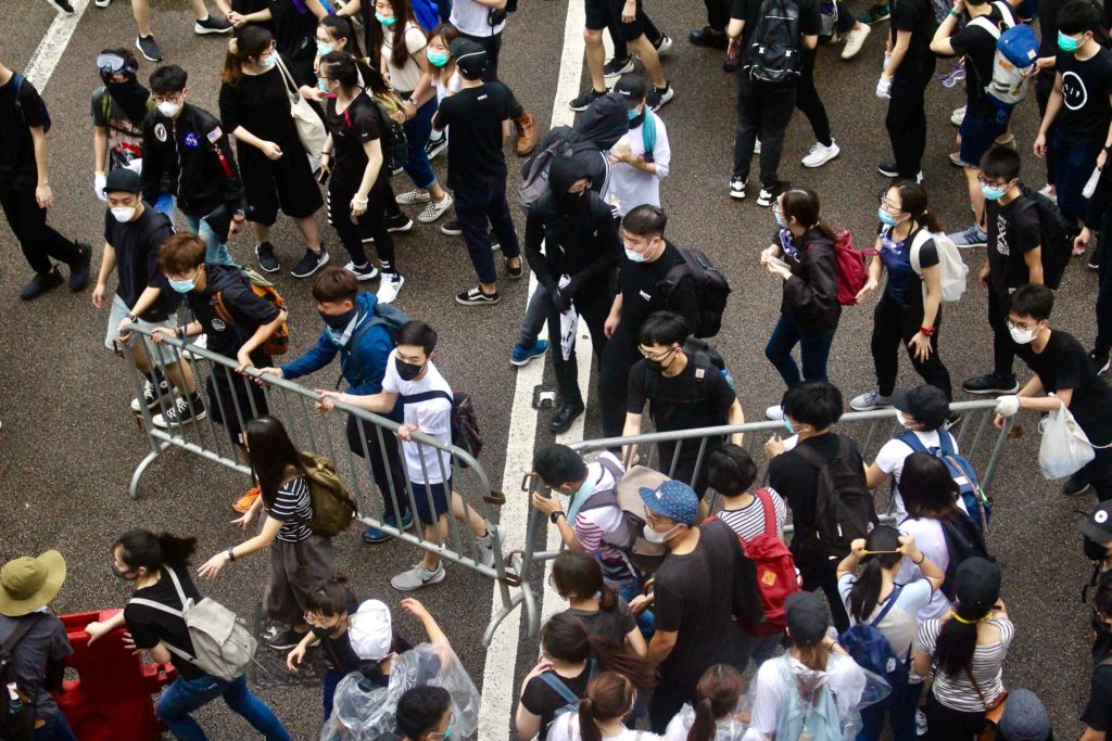 Thousands of protesters flood Connaught Road Central in a bid to stop lawmakers from entering the Legislative Council to hold a second reading of a controversial extradition bill.