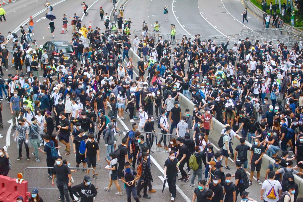 Thousands of protesters flood Connaught Road Central in a bid to stop lawmakers from entering the Legislative Council to hold a second reading of a controversial extradition bill. Photo by Vicky Wong.