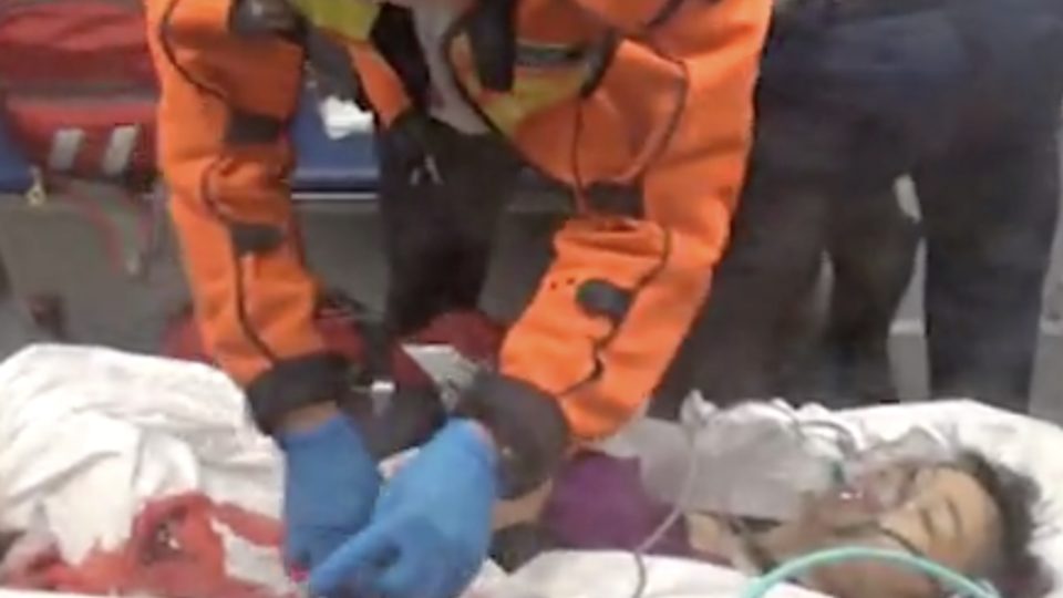 A 35-year-old woman is taken to hospital after she got stabbed five times in the abdomen by her ex-husband. Screengrab via Apple Daily video.
