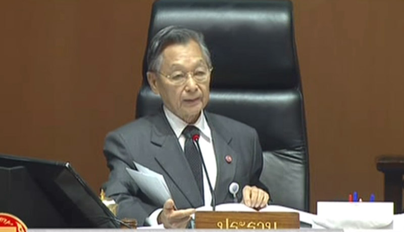 House Speaker Chuan Leekpai proceeds over Wednesday’s marathon debate in Thailand’s parliament at the TOT building in Bangkok.