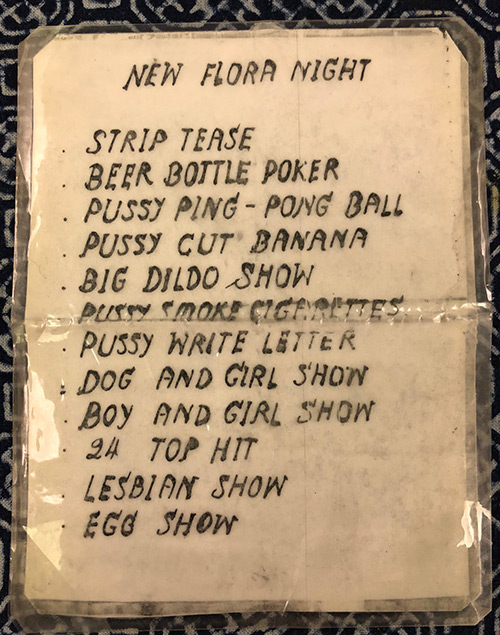 The infamous, dirty, laminated lists of genital feats promised to Patpong passers-by. Photo: Patpong Museum / Courtesy 