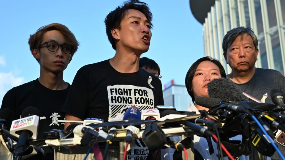 Civil Human Rights Front (CHRF) member Jimmy Sham (C) speaks during a press conference in Hong Kong on June 15, 2019 after Hong Kong Chief Executive Carrie Lam suspended a hugely divisive bill that would allow extraditions to China in a major climbdown after a week of unprecedented protests and political unrest. Hector Retamal / AFP 