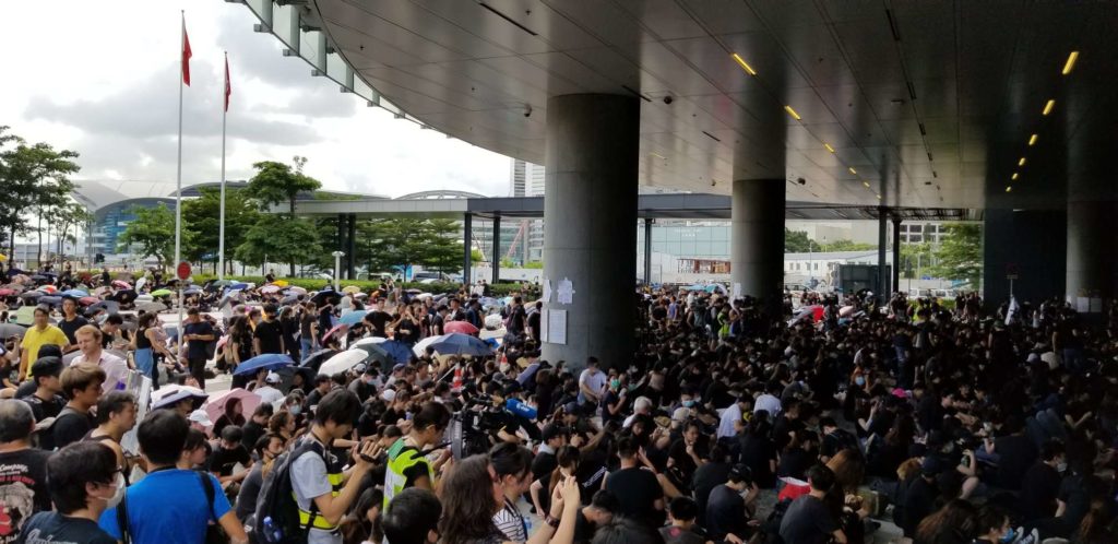 A crowd of a few hundred protesters gathers at the LegCo this morning seeking the full withdrawal of a controversial extradition bill. Photo by Vicky Wong.