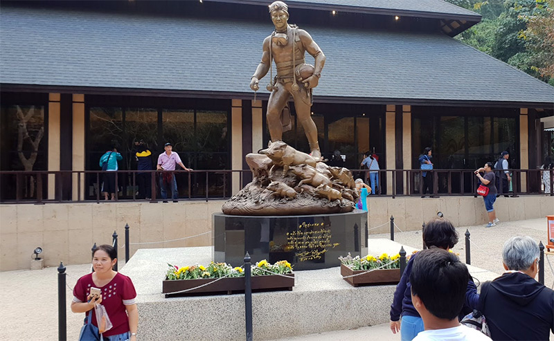 Tourists take photos in January before a statue of the Thai Navy SEAL who died during the rescue operation at the Tham Luang complex in Chiang Rai province. Photo: Todd Ruiz