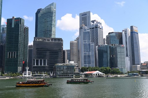 A general view of Singapore’s financial business district is seen from Marina Bay in Singapore on July 12, 2019. (Photo by Roslan RAHMAN / AFP)