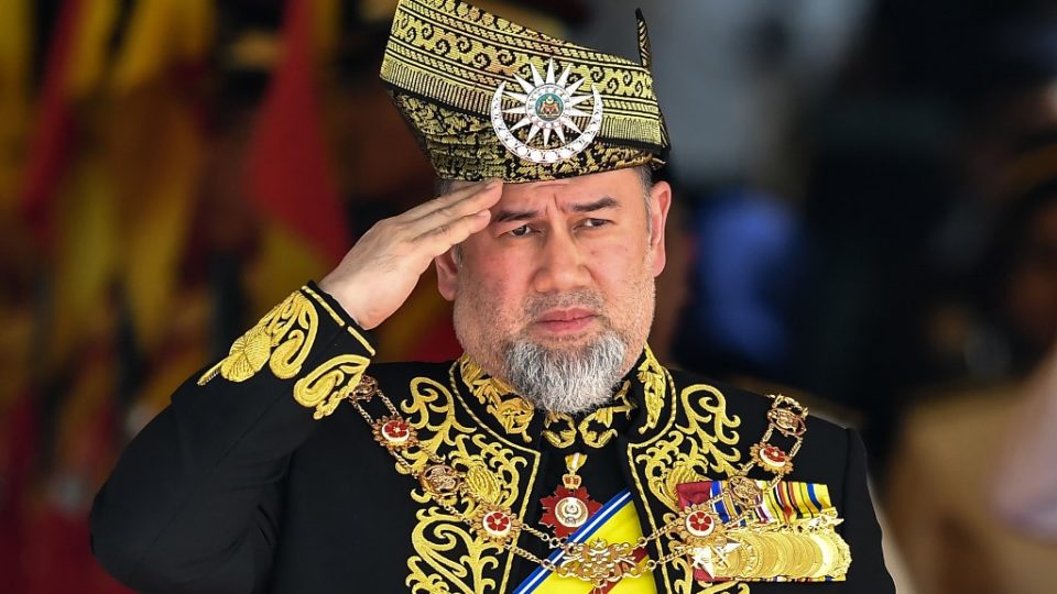 (FILES) In this file photo taken on July 17, 2018, Malaysia’s Sultan Muhammad V salutes the royal guard of honour during the opening ceremony of the parliament in Kuala Lumpur. – Malaysia’s former king has divorced a former Russian beauty queen just months after news of their wedding emerged and he abdicated in a first for the country, his lawyer said. The former Miss Moscow, however, says she is still married to Sultan Muhammad V, and has continued to post pictures of the couple on social media. (Photo by Mohd RASFAN / AFP)