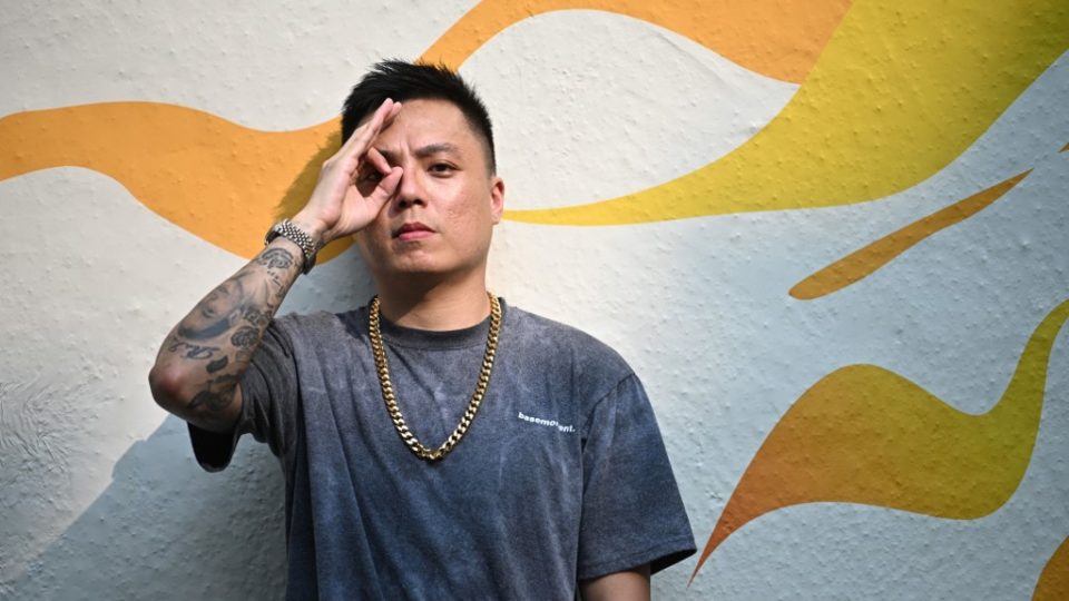 This photo taken on July 18, 2019 shows Singaporean rap artist Joshua Su posing during an interview with AFP in Hong Kong. (Photo by Anthony WALLACE / AFP) 