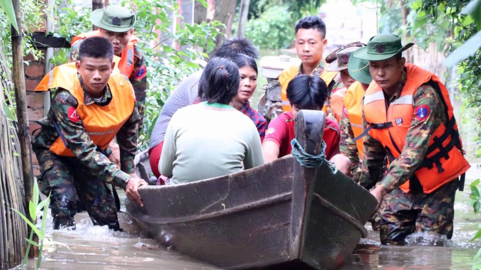 Military officers rescuing displaced flood victims in Myanmar via Office of the Commander-In-Chief of Defence Services website