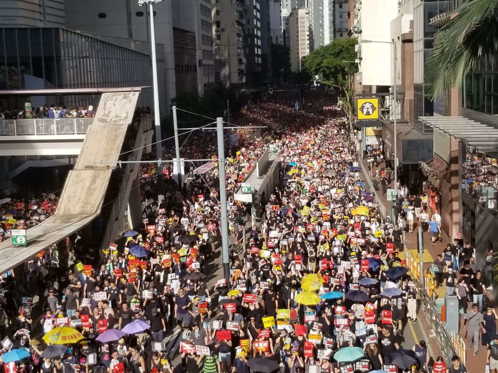 Demonstrators take part in a peaceful march organized by the Civil Human Rights Front. Photo by Vicky Wong.