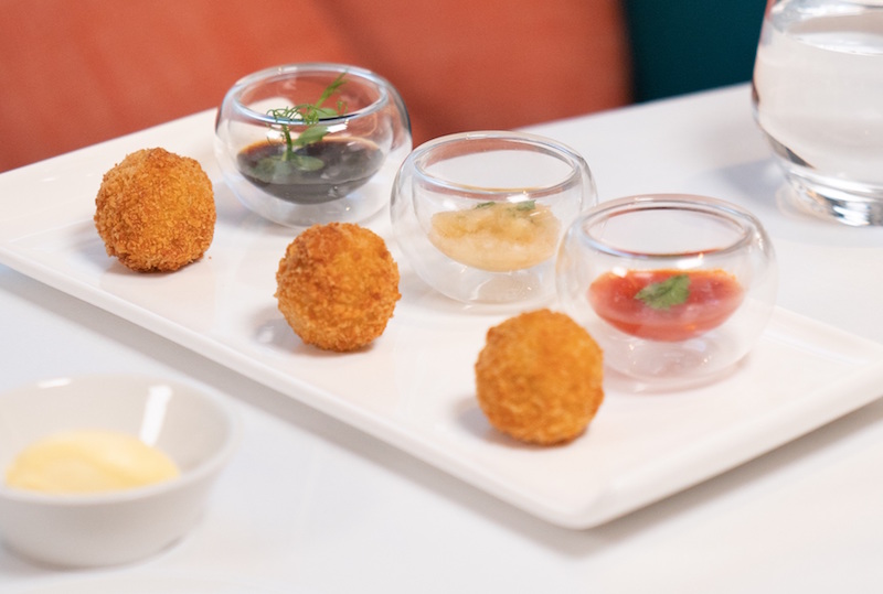 Chicken rice arancini. Photo: Tablescape