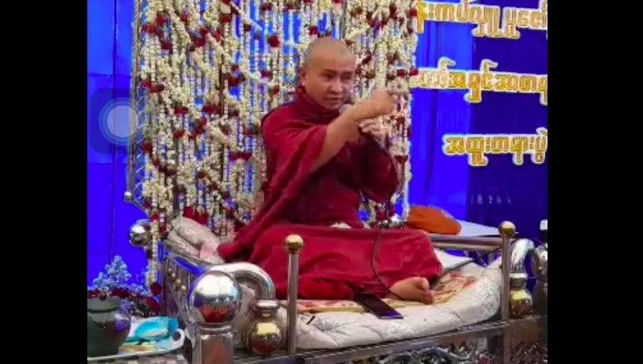 Koebweya Sayadaw Ashinasayar gesturing with his finger when he vowed to “line up and shoot all LGBTQ” in Myanmar via Facebook screengrab