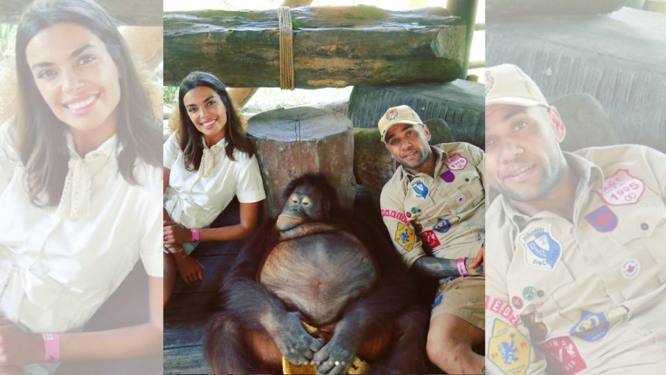 Spanish model Joana Sanz and Brazilian pro soccer player Dani Alves pose with an orangutan at Bali Safari and Marine Park. (Photo: Dani Alves / Instagram)