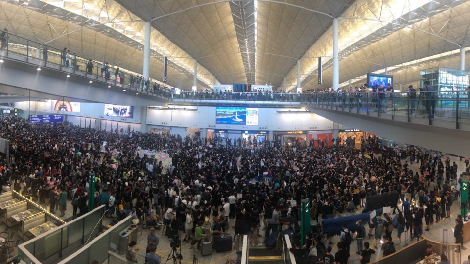 A crowd of pro-democracy protesters gathered at Hong Kong International Airport today to spread their message to international arrivals to the city. Photo by Iris To.