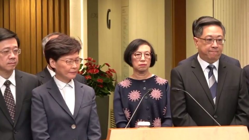 Security Secretary John Lee (left), Chief Executive Carrie Lam (second left), and Police Commissioner Stephen Lo (far right) face the press this afternoon. Screengrab via RTHK video.