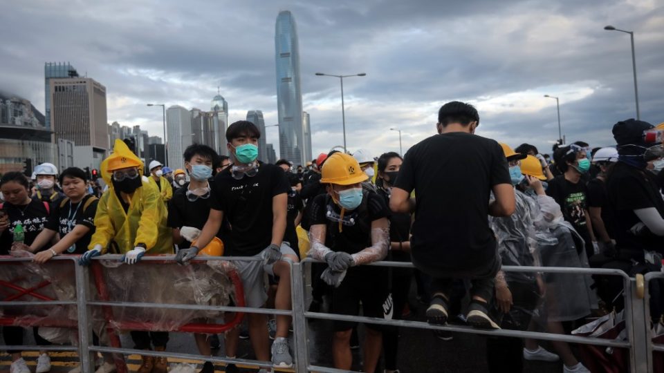 Protesters set up barricades at Lung Wo Road outside the Legislative Council in Hong Kong before the flag raising ceremony to mark the 22nd anniversary of handover to China early this morning. Photo via AFP.