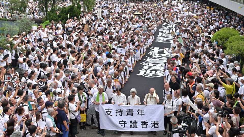 A group of elderly people march to the government headquarters in Hong Kong yesterday in solidarity with the city’s young anti-government protesters. Photo via AFP